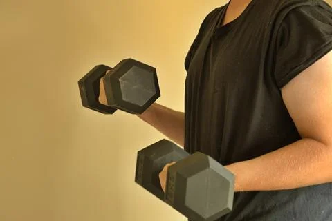 Man weigh training using dumb bells Stock Photos