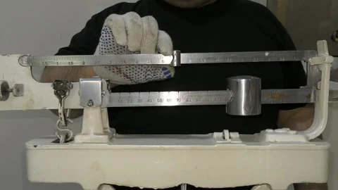 The man is weighed on the scales Stock Footage 144756789