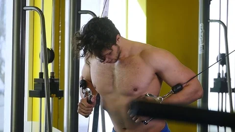 Man with weight training in gym equipment sport club Stock Footage