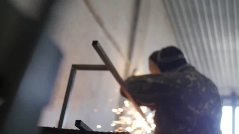 A man  weld a metal construction Stock Footage 130710876