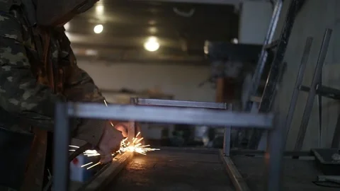 A man  weld a metal construction Stock Footage 130710956