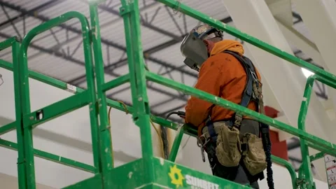 Man welding beam in warehouse Stock Footage 229654084