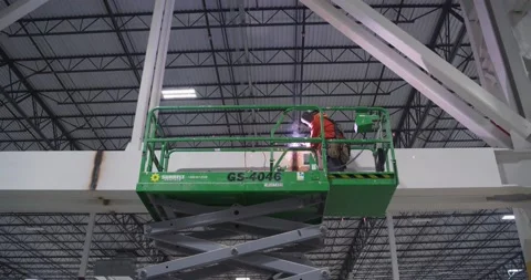 Man welding beam in warehouse Stock Footage 229654234