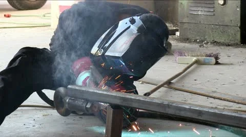 Man Welding in Factory Stock Footage 21469811
