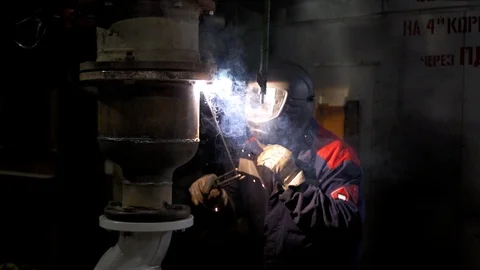 The man is welding at the factory Stock Footage 103182187