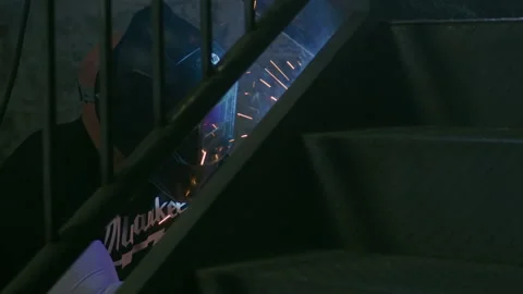 Man Welding Inside Stairs Stock Footage 137212406