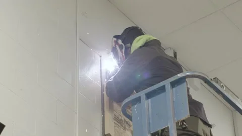 Man welding on lift Stock Footage 238859699
