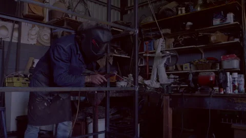 Man welding metal in his workshop Stock Footage 278986205