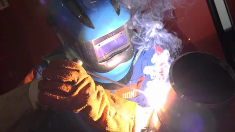 Man welding a pipe in slow motion Stock Footage 120297973