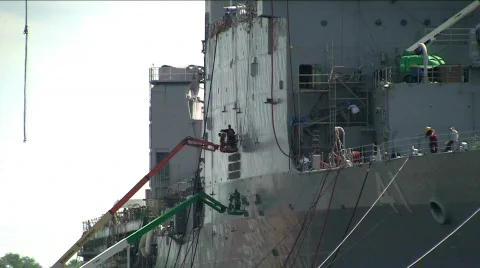 Man welding on side of ship Stock Footage 500912