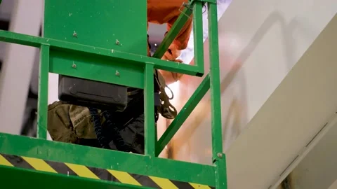 Man welding in warehouse Stock Footage 229654176