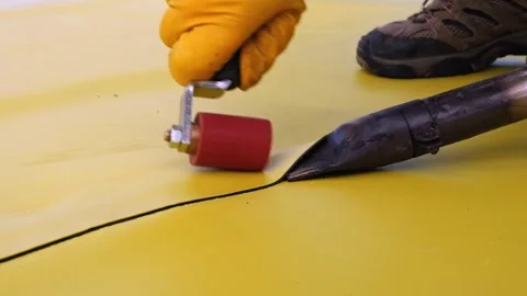 A man welding waterproofing material Stock Footage 331357970