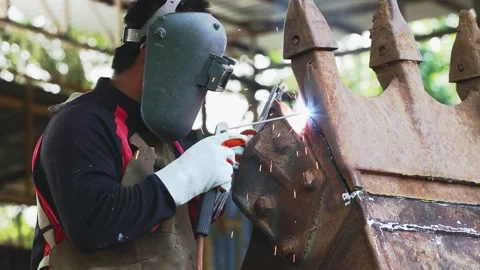 The man is welding. Welding with argon or electrode. Stock Footage 194479023