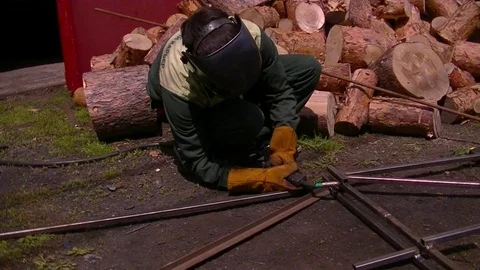 Man welds metal Stock Footage 76395014