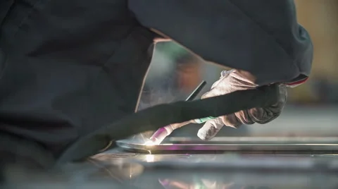 Man welds something to metal frame Stock Footage 43740843