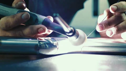 Man welds a stainless pipe. Stock Footage 157881466