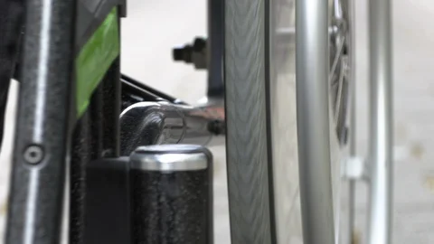 A man in a wheelchair cannot drive into a small shop Stock Footage 125510143