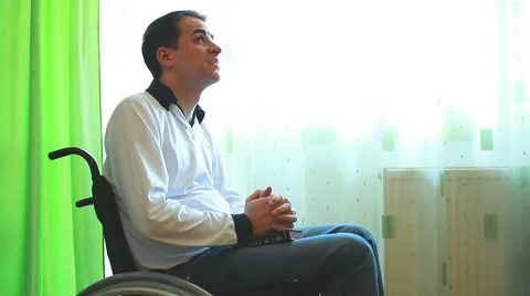 Man in a wheelchair praying Stock Footage 42176793