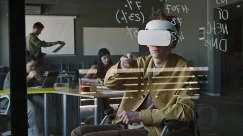 Man in Wheelchair Testing Augmented Reality App with VR Headset in Office Stock Footage 275074813