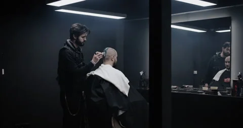 A man while barber applying shaving cream on his head using shaving brush. Stock Footage 150273327