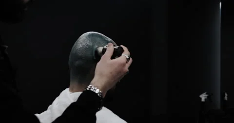 A man while barber applying shaving cream on his head using shaving brush. Stock Footage 150273507
