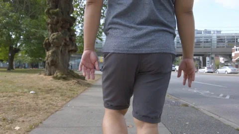 A man while walking in the city center of Vancouver,Canada in summer Stock Footage 119316085