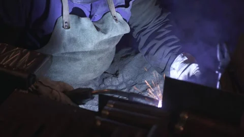 A man while working with a welding machine Stock Footage 288485006