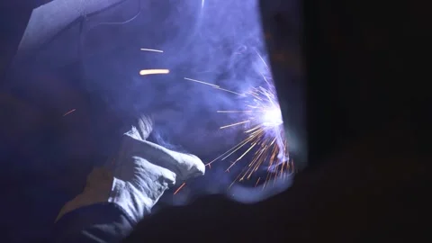 A man while working with a welding machine Stock Footage 288485036