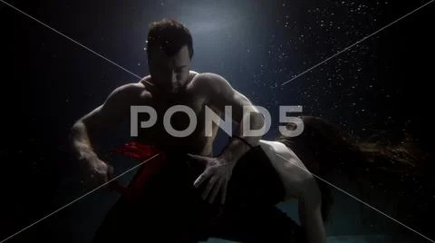 Man is whipping with whip his girlfriend floating underwater bdsm  