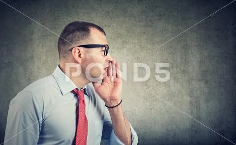 Man whispering private information a secret Stock Photos