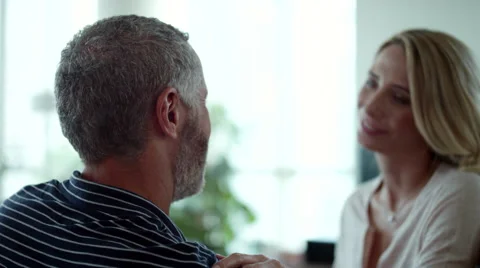 Man whispering in womans ear. Stock Footage 64121488