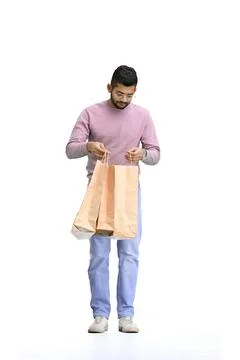 Man, on a white background, full-length, with bags Stockfoto's