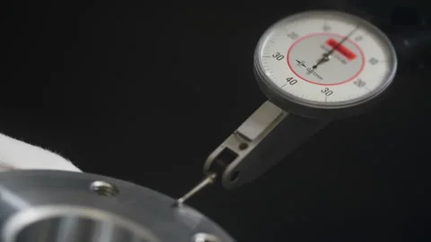 Man in white gloves checks a piece of machined aluminum with a feeler gauge Video stock 201314084