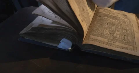 Man in White Gloves is Leafing Through The Old Book, Pages with Pictures Stock Footage 52347647