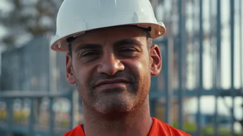 Man with a white helmet smiling at the camera Stock Footage 331514322