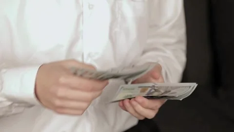 Man in white shirt counting dollars by hands. closeup of businessman hands Vídeo Stock 336263631