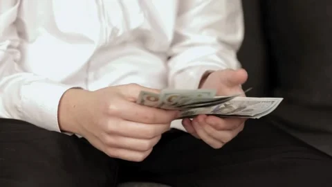Man in white shirt counting dollars by hands. closeup of businessman hands Stock-Footage 336263656