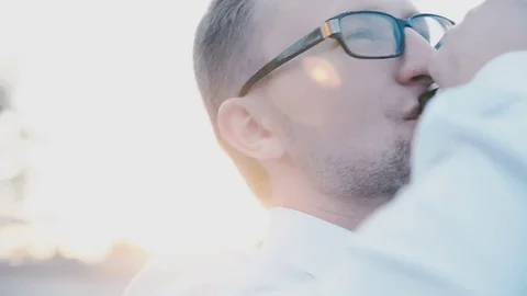 Man in a white shirt drinks from a bottle Stock Footage 81543806