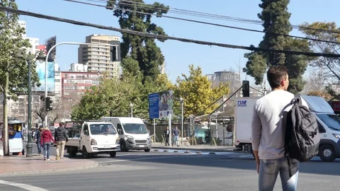 Man on white shirt stands at the intersection Stock Footage 96591030