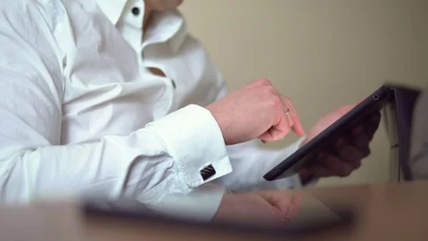 The man in the white shirt working on a tablet. Office Stock Footage 72252683