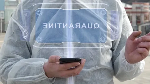 Man in white with text Quarantine Video stock 145753728