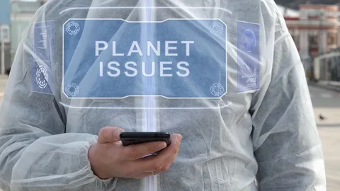 Man in white uses holographic text Planet issues 스톡 동영상 129065166