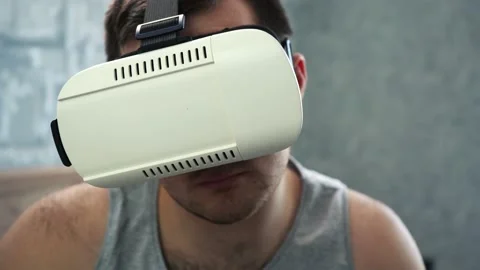 Man in white vr glasses sitting close-up Stock Footage 149600519