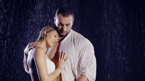 Man in a white wet clothes and his beloved from whom he is expecting a child Stock Footage