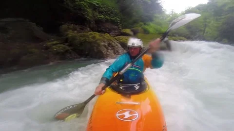 Man whitewater kayaking through river 스톡 동영상 72500628