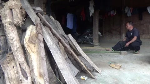 Man is whittling bamboo to weave baskets Stock Footage 320179745