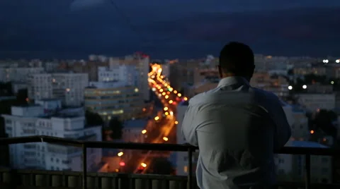 A man who has problems standing against the background of the city Stock Footage 41212558