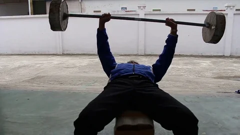 The man who is lifting weights Stock Footage 72976593
