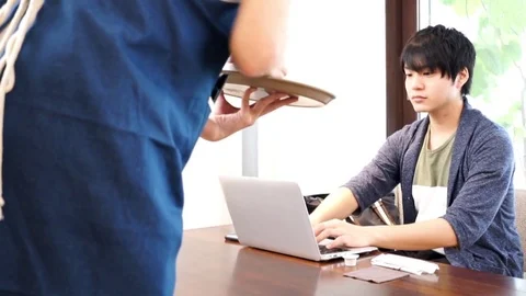 Man who orders coffee at a cafe Stock Footage 72558643