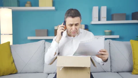 The man who received the wrong shipping package. He is on the phone with the cou Stock Footage 237045240